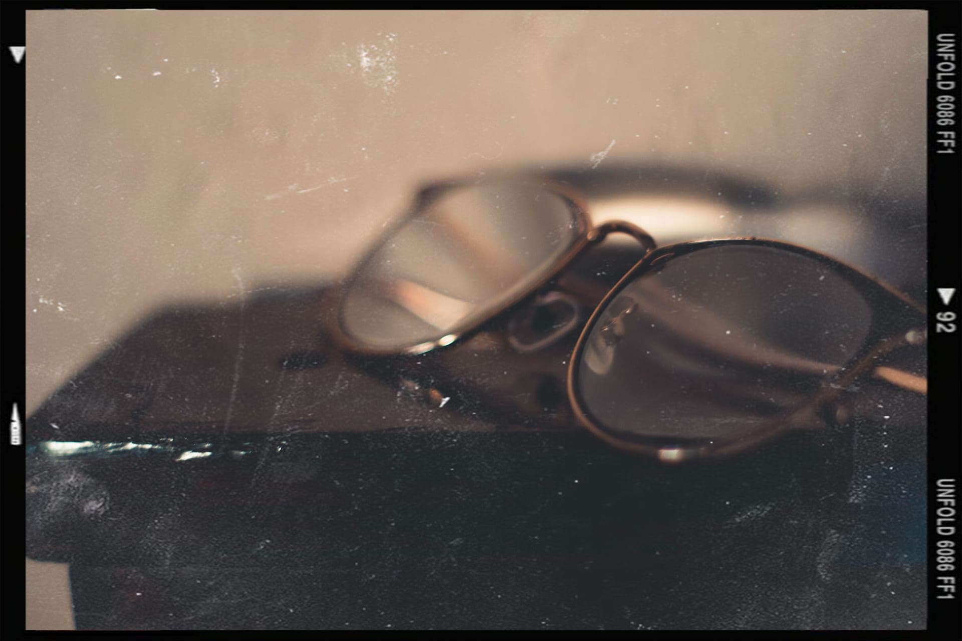 Vintage eyeglasses resting on a book